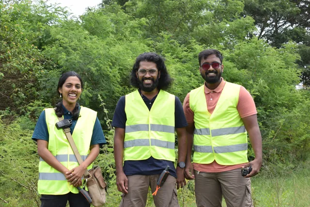 Three members of the Naav field team in high-visibility vests on a survey site